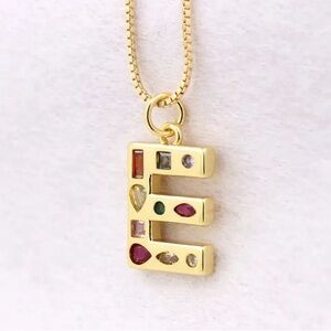 Letter “E” Pendant on Gold Coloured Chain
